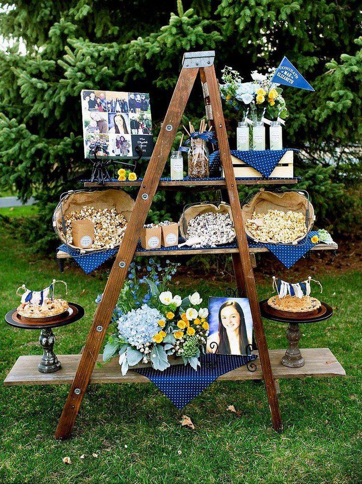 Cute girls graduation party centerpiece with floral accents