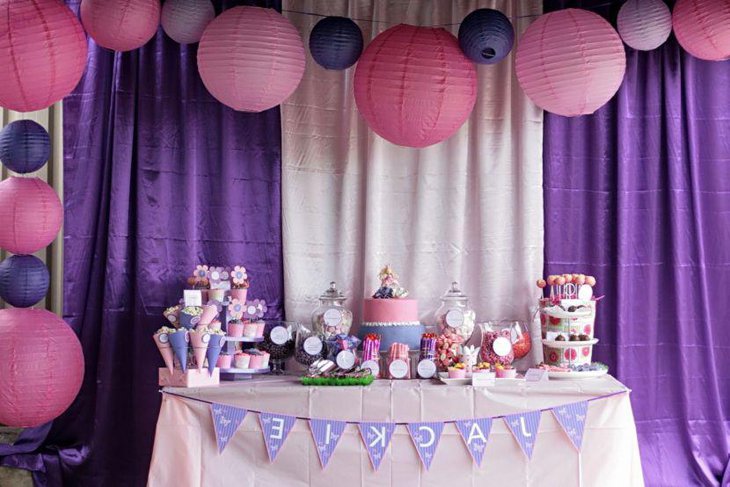 Cute kids birthday party table decor with purple tones