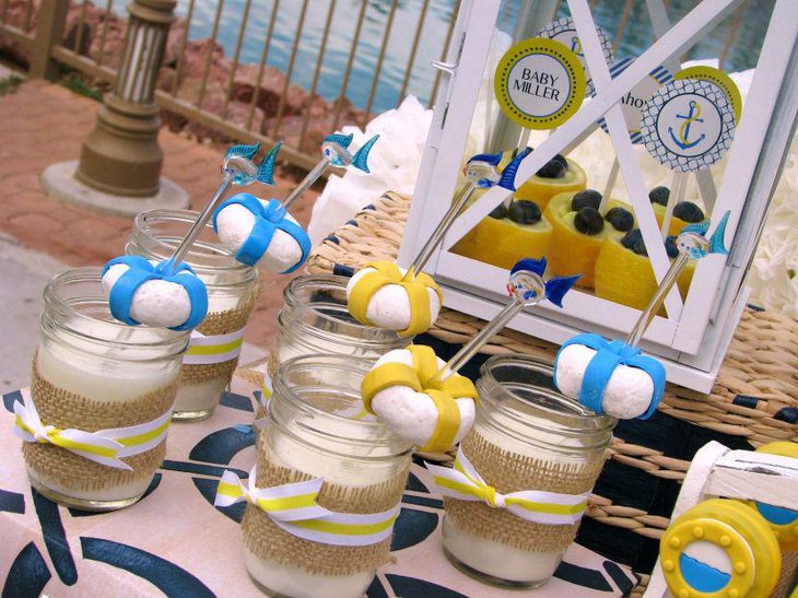 Cute nautical baby shower table decor with jars and DIY lifesavers