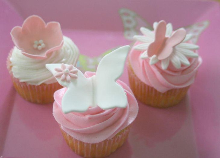 Cute pastel butterfly themed cupcakes for baby shower