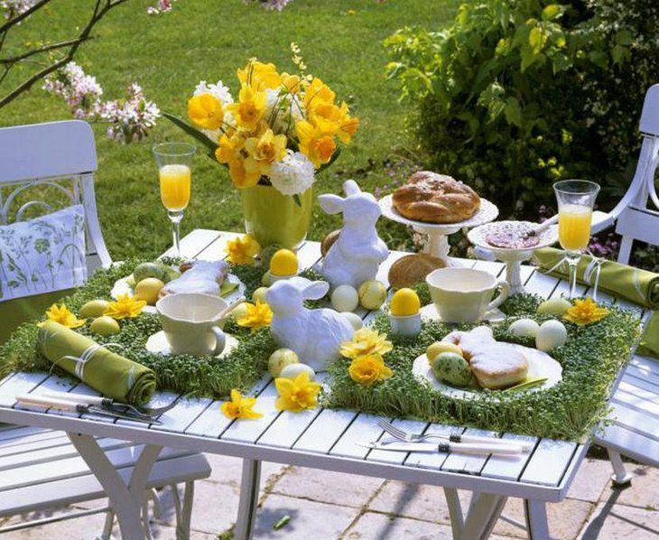 Cute yellow floral arrangement on spring garden party table