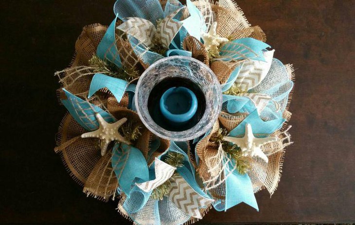 Deco mesh and burlap wedding table centerpiece with a beach theme