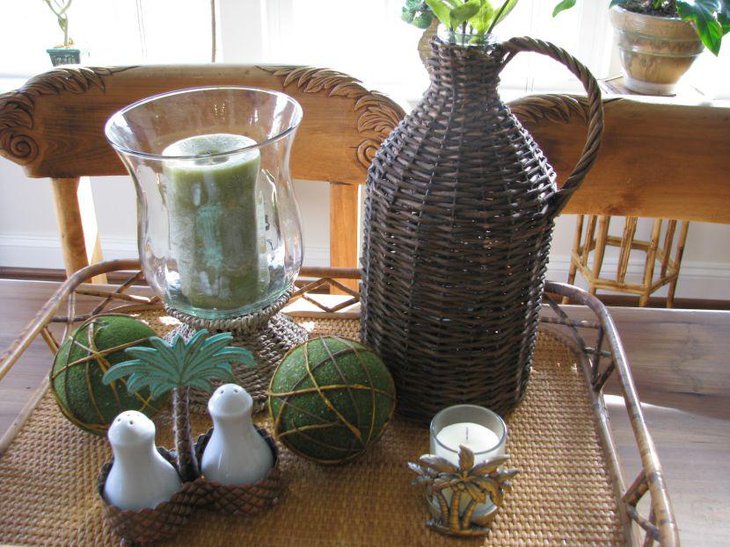 Demijohn vignette with glass candle jar and green balls