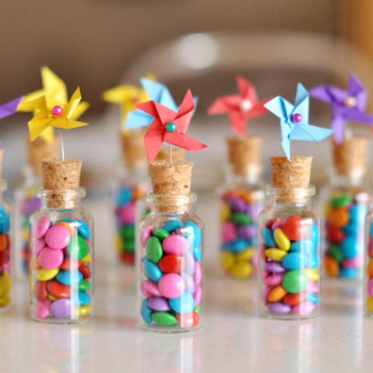 DIY Birthday Table Decor With Pinwheel and Glass Jars Filled with Gems