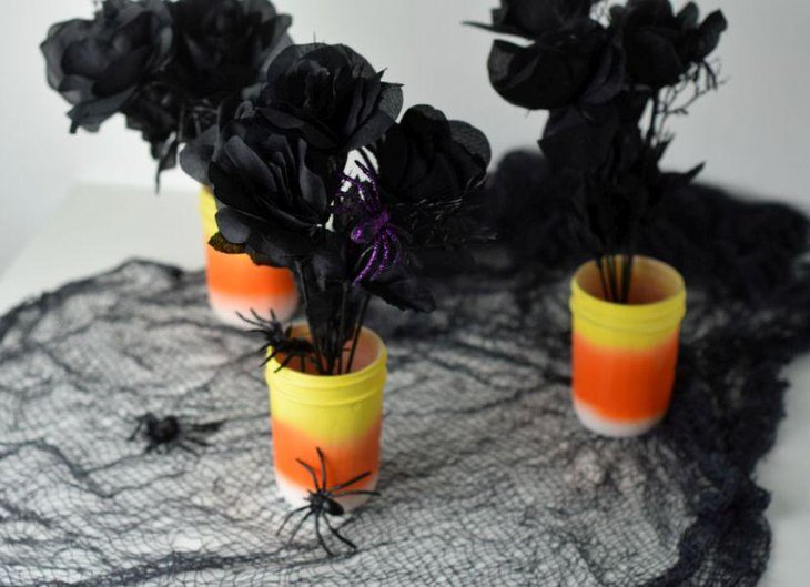 DIY candy corn centerpiece with spiders and black roses