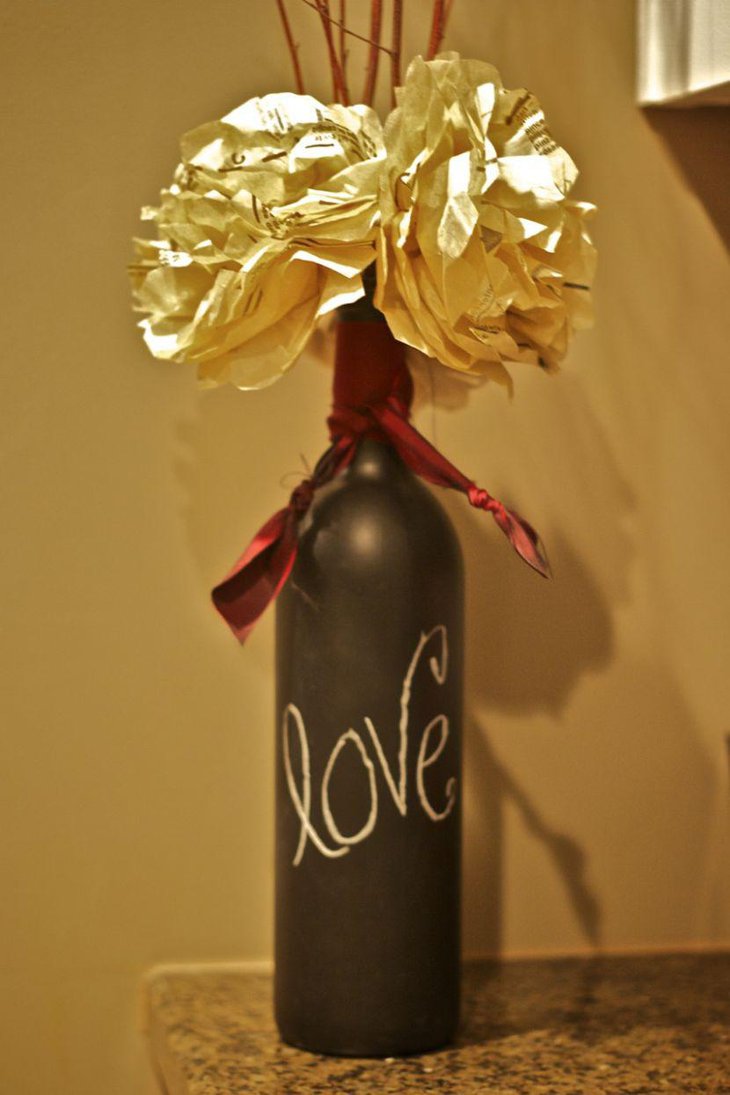 DIY Chalkboard Wine Bottle Centerpiece With Paper Flower and Twig Arrangement