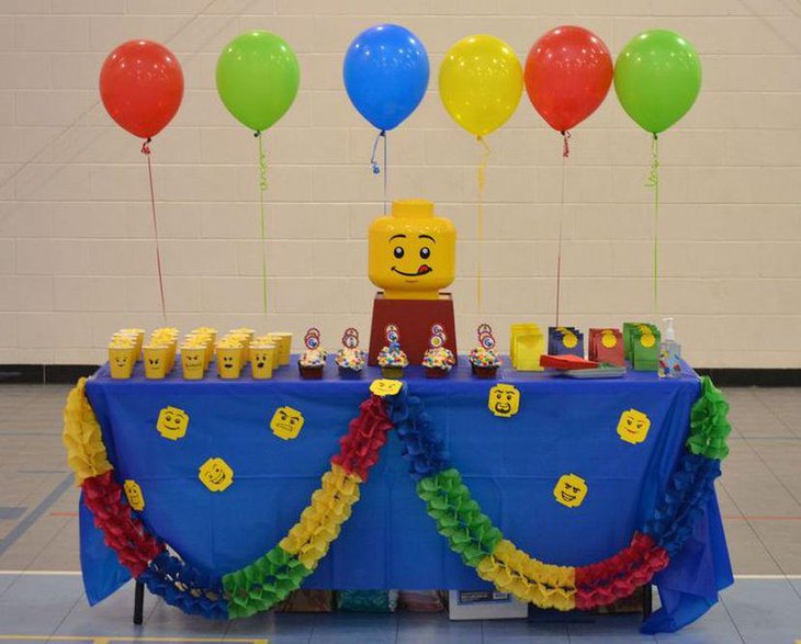 DIY Lego themed party table with Lego face embossed paper cups