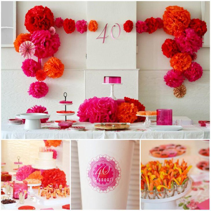 DIY pink orange and red flower arrangement on party table