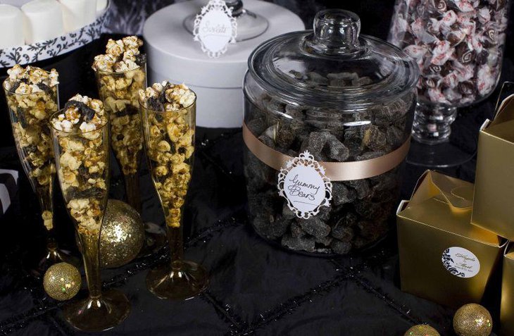DIY wedding candy table with glasses and jars