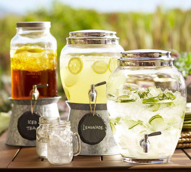 Drinks table setup with beverages and coolers served in mason jars