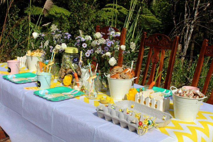 Easter garden party table decor with yellow and white table runner