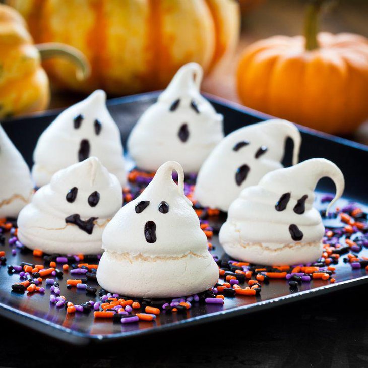 Edible chocolate ghosts on tray decorations on kids Halloween table