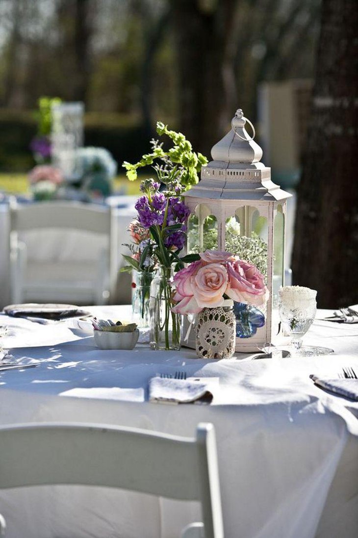 Elegant vintage lantern decoration on wedding garden party table
