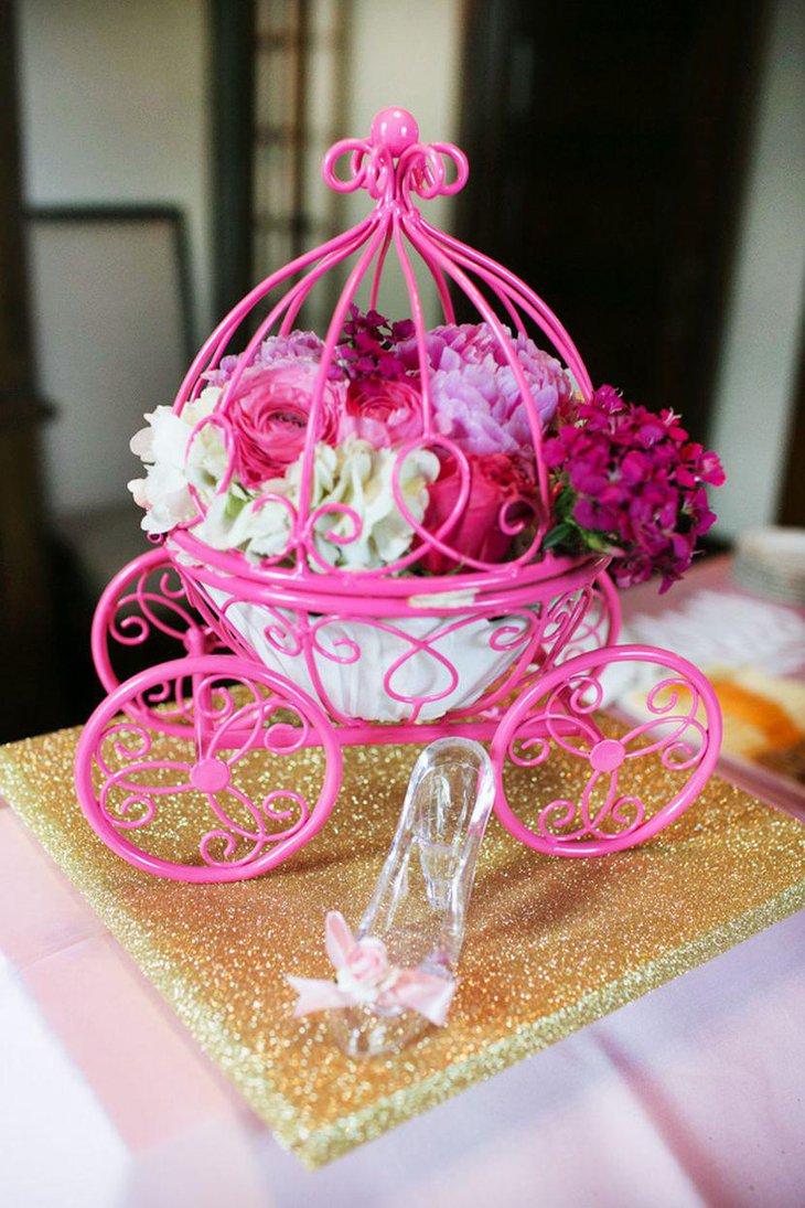 Enchanting floral carriage centerpiece for girl baby shower table