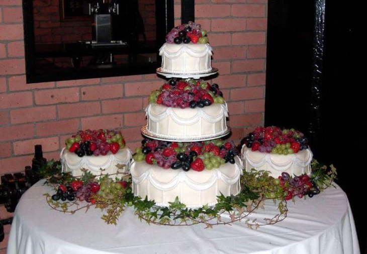 Fall wedding cake table decorations with grapes and berries