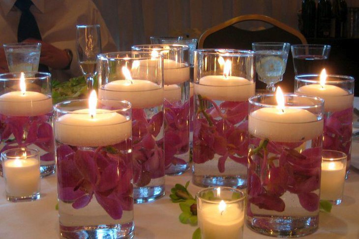 Floral floating candle centerpiece on wedding table