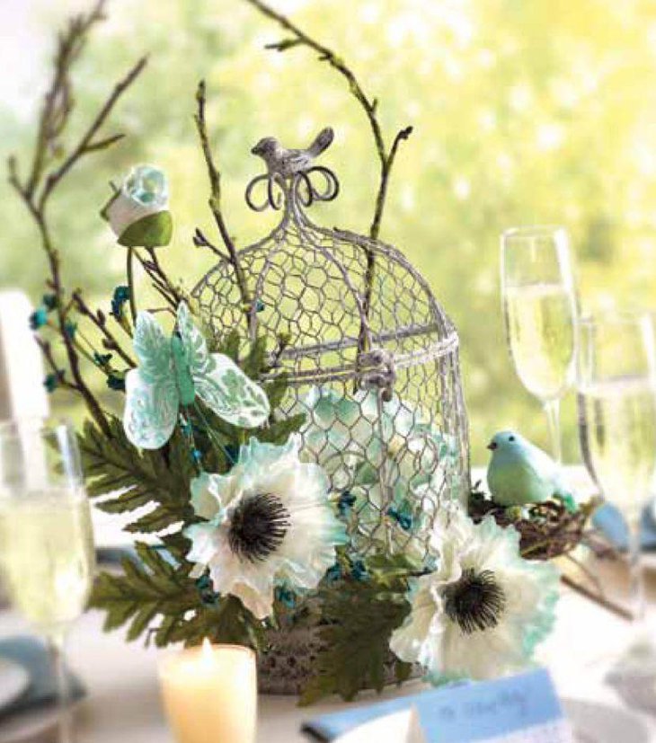 Flowers filled wedding birdcage centerpiece