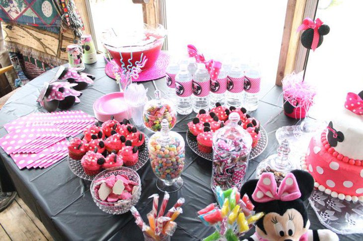 Fun candy table decor with pink and black Minnie Mouse theme