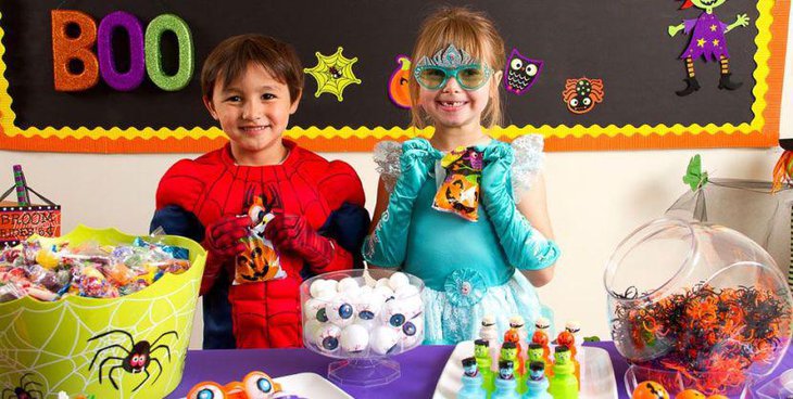 Fun kids Halloween treats table with monster eyeballs and spiders