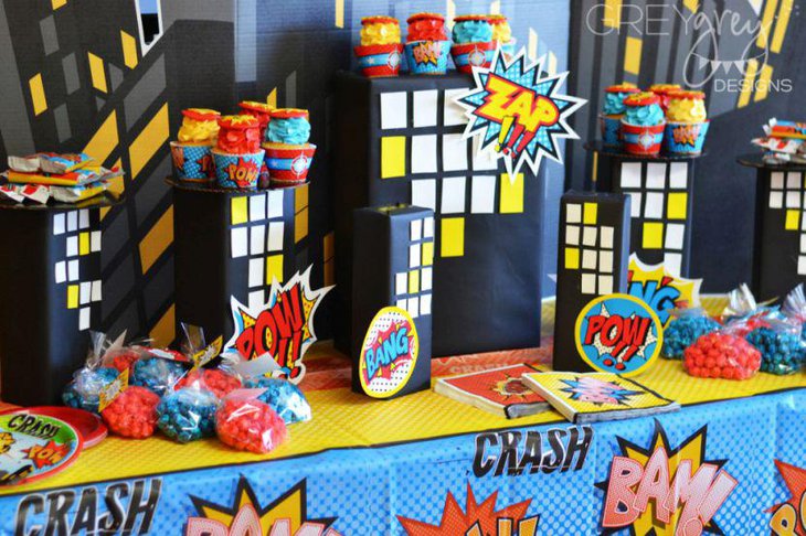 Fun superhero themed first birthday party table setting for boys