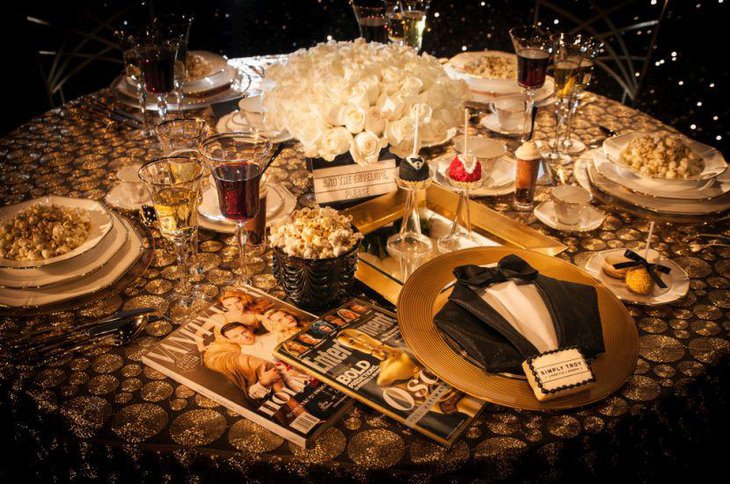 Golden accented Oscar themed party table decor