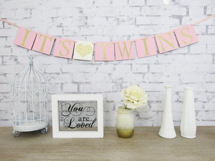 Golden accented twin baby shower table decor