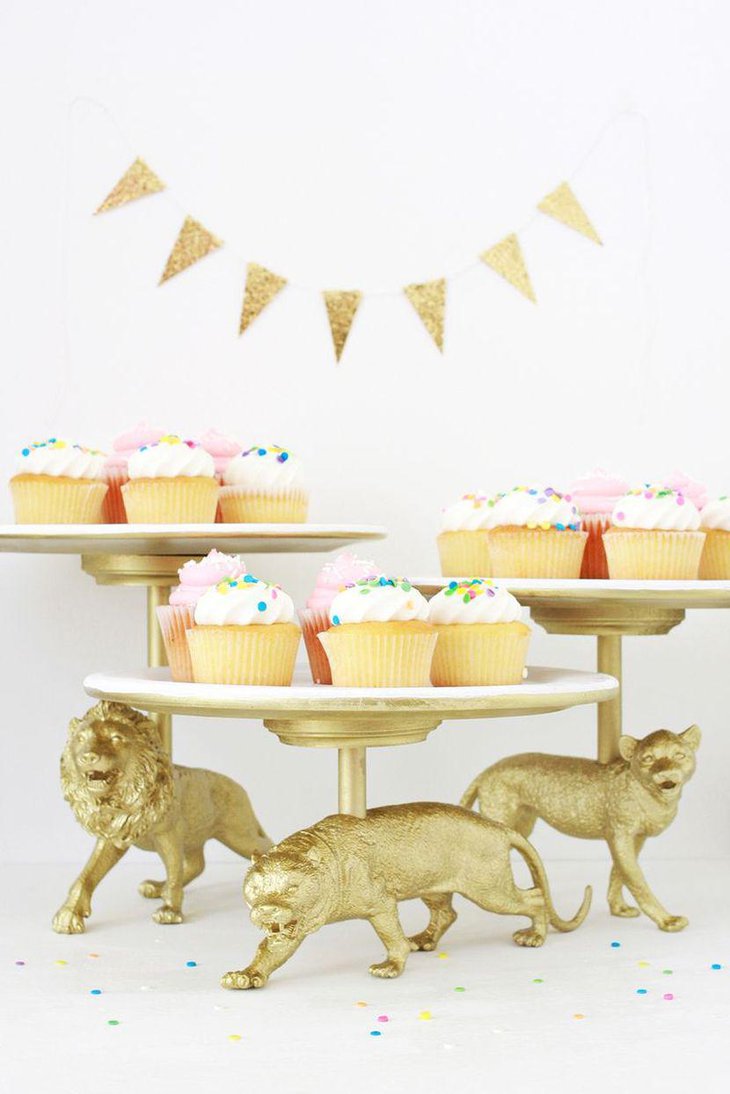 Golden vintage wild cat cake stand decor on tea party dessert table