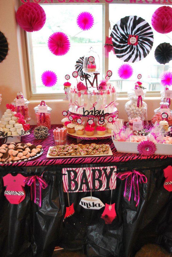 Gorgeous baby shower candy buffet table in pink accents