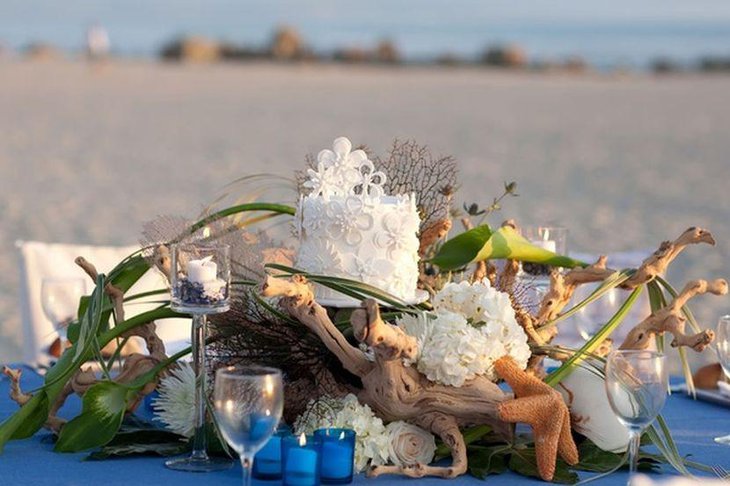 Gorgeous beach theme wedding centerpiece idea with driftwood