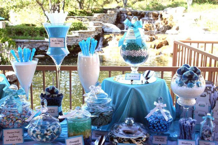 Gorgeous blue wedding candy table with blue rock candy and treats