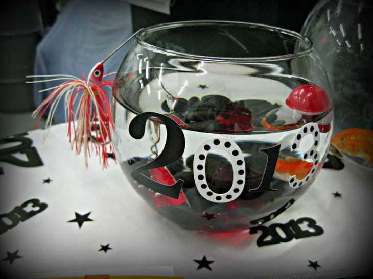 Gorgeous bowl centerpiece on graduation party table for guys
