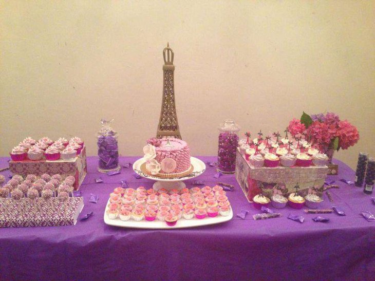 Gorgeous Paris themed sweet 16 birthday table decor in purple tones