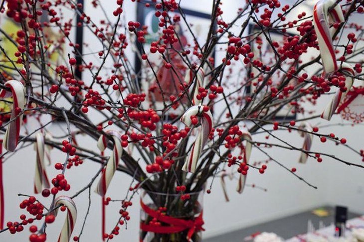 Gorgeous red winter table manzanita branch with berries centerpiece