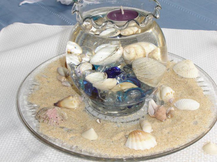 Gorgeous shell and glass bowl wedding centerpiece idea