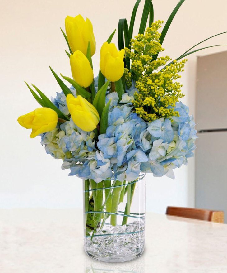 Gorgeous tulips in vase table centerpiece for spring