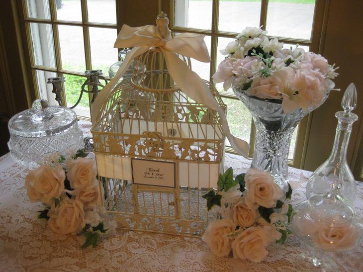 Gorgeous vintage birdcage cardholder centerpiece on wedding table 1