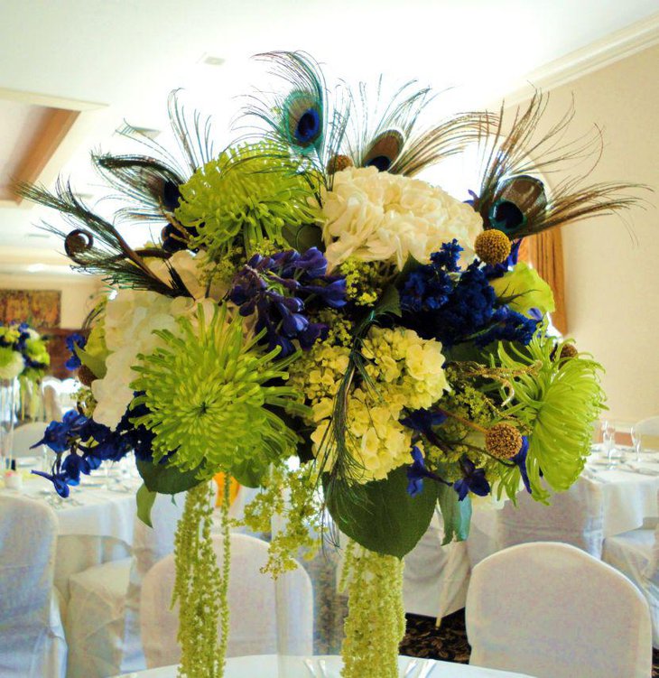 Gorgeous wedding table peacock floral centerpiece