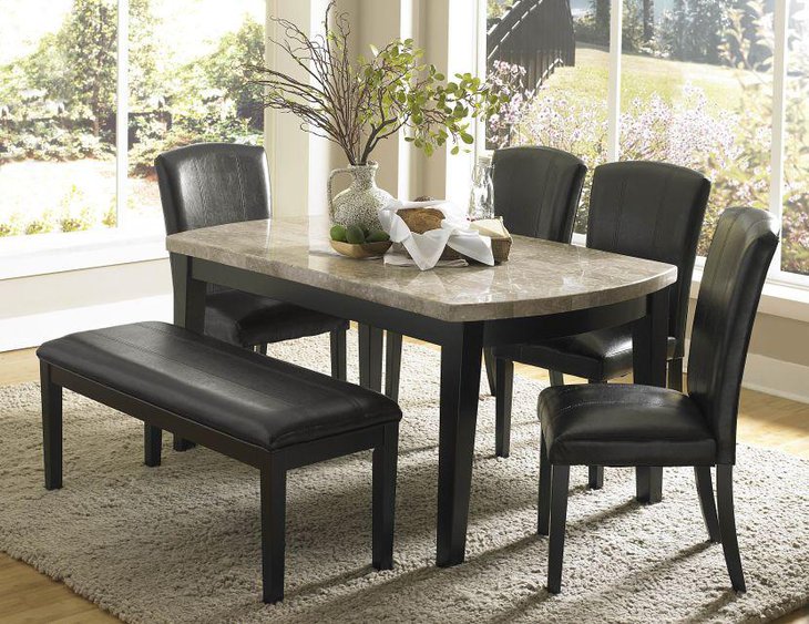 Granite dining table with black leather chairs and bench