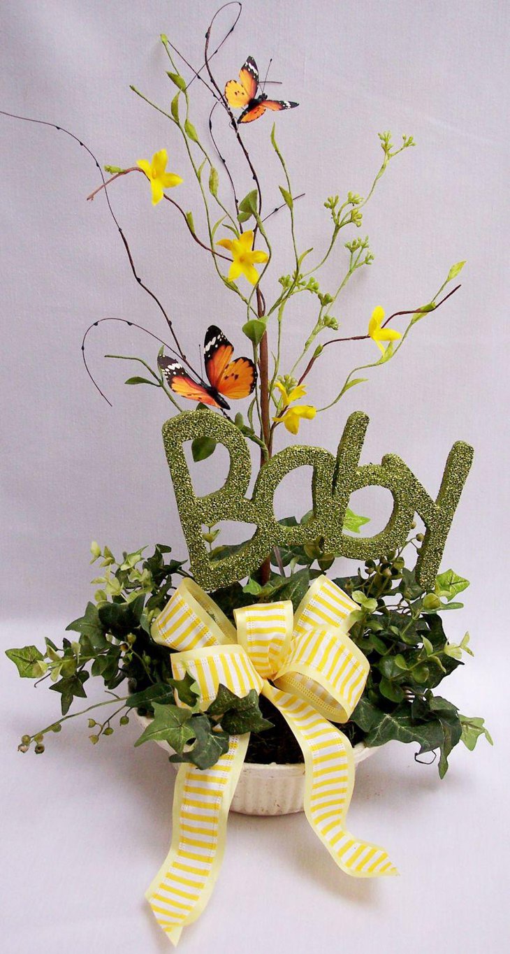 Green accented baby shower centerpiece with butterfly theme
