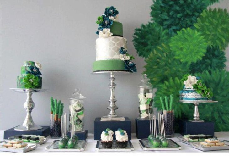 Green dessert table decorated with leaves