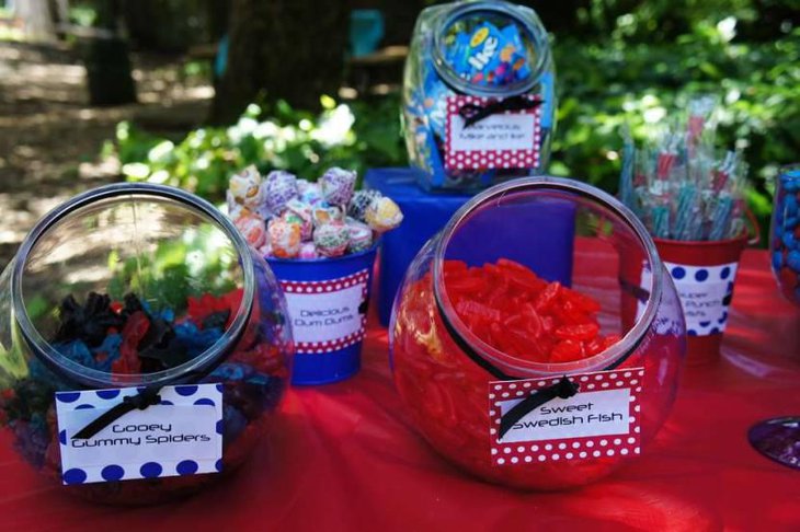 Gummy Spiders In Red Blue And Black On A Dessert Table
