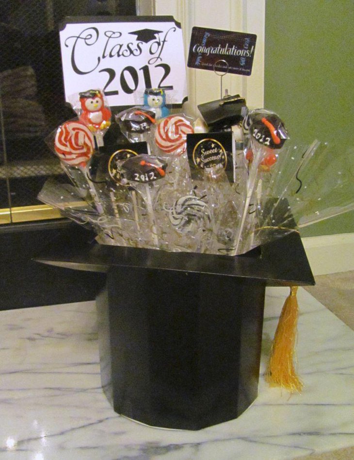 Homemade graduation candy centerpiece using mortar board box