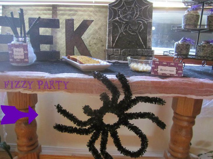 Kids Halloween table decor with a creepy crawly spider