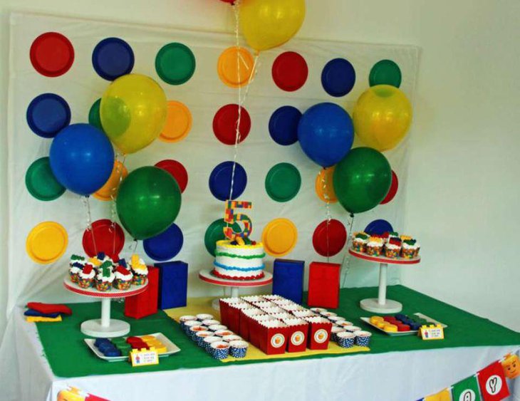 Lego inspired cake and cookies as party table centerpieces