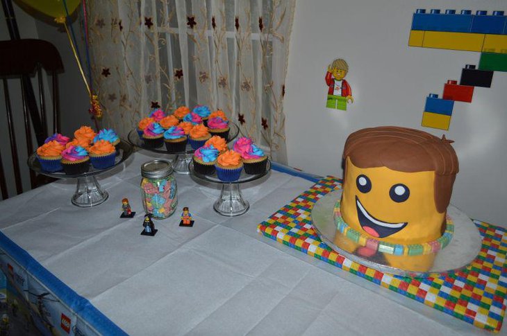 Lego themed party table setting with Emmet cake and Lego figurines