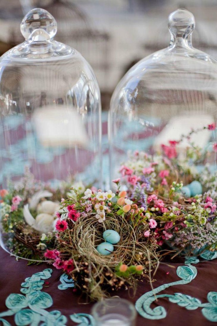 Little nests under glass cloches wedding table vignette idea