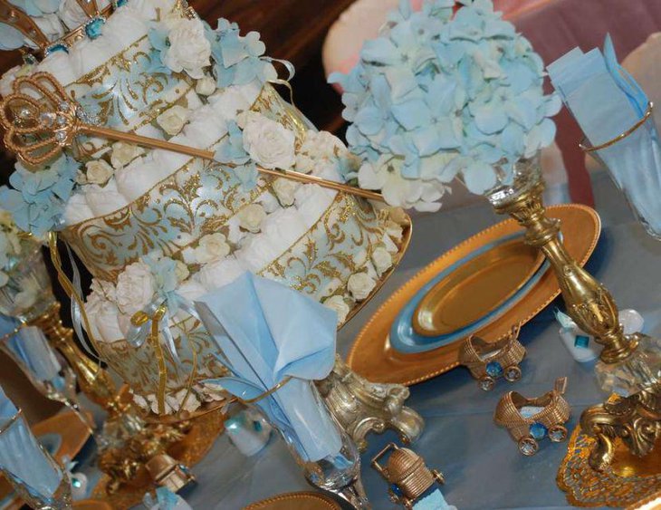 Little prince and princess themed twin baby shower table in golden accents