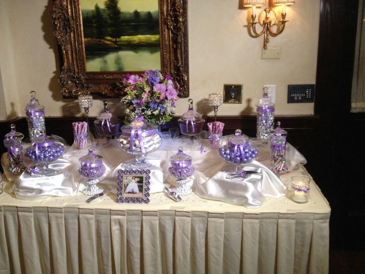 Lovely white and lavender wedding candy table decor