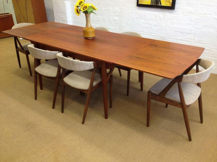 Mid century wooden table with white chairs