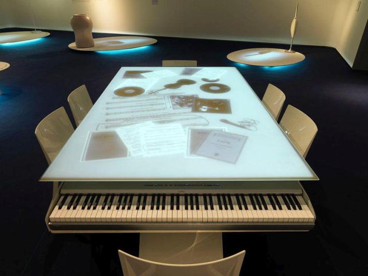 Modern dinner table with integrated piano